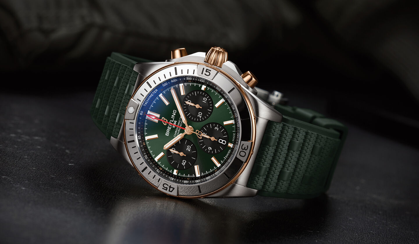 Breitling Chronomat watch on a black background.