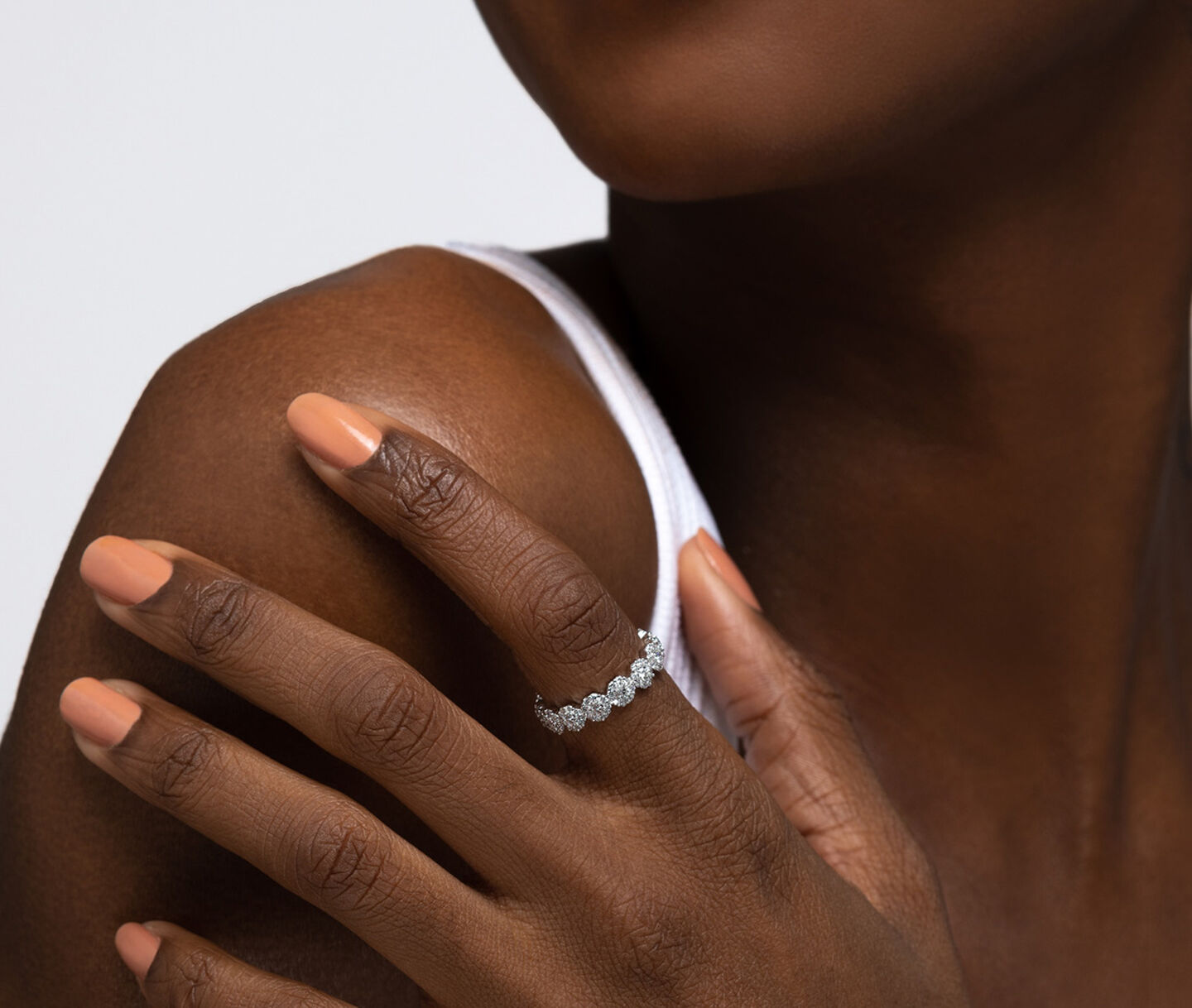 A woman wearing a Birks Iconic Snowflake diamond ring.