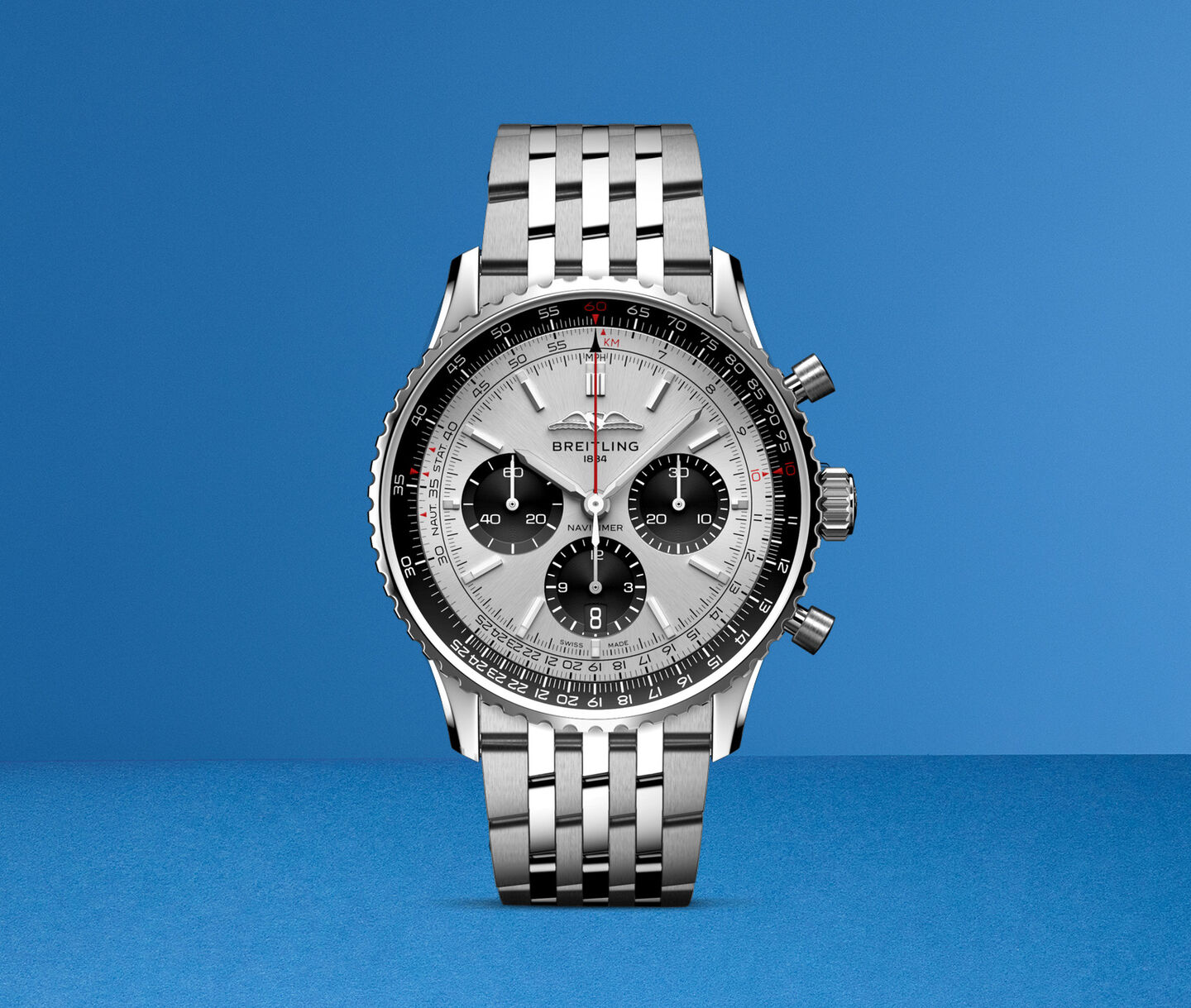 A Breitling navitimer watch on a blue background