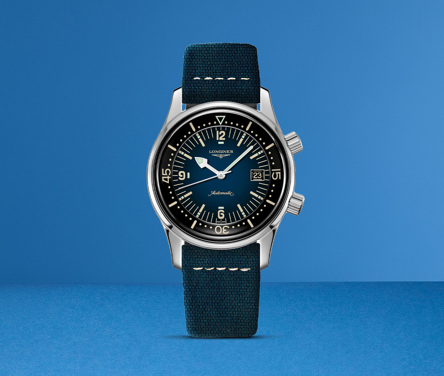 A longines watch on a blue background.