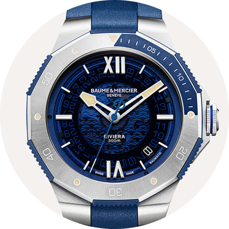 Baume & Mercier Riviera watch on a grey background.