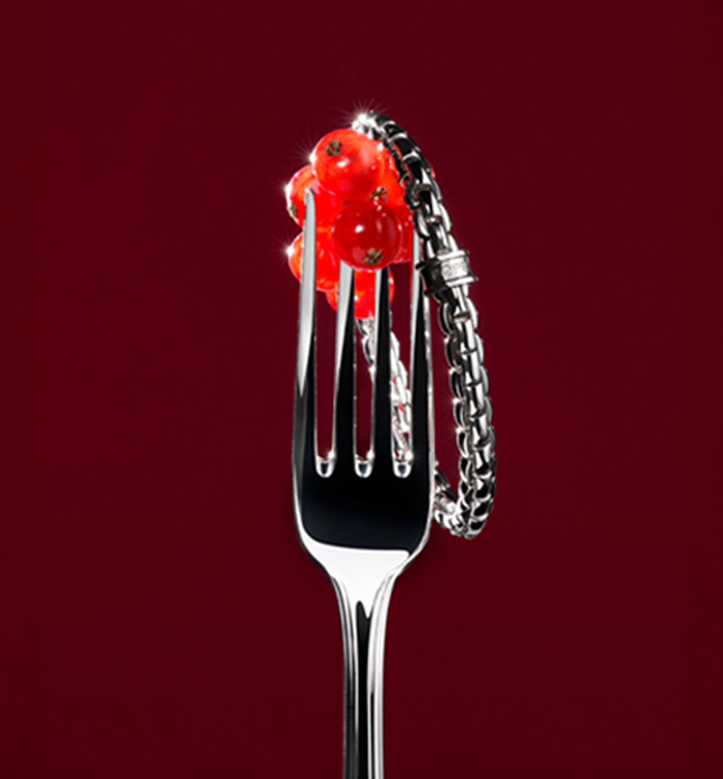 FOPE white gold bracelet on a red background.