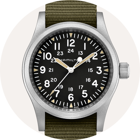 Hamilton watch on beige background.