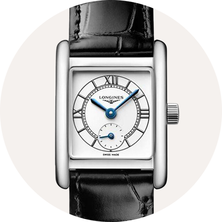 Longines DolceVita watch on a beige background.