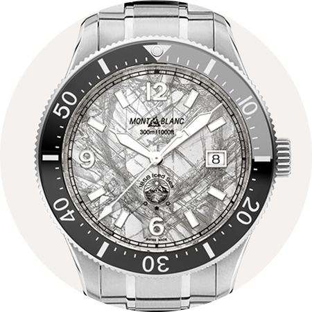 Montblanc 1858 watch on a grey background.