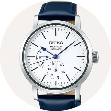 Seiko watch on beige background.