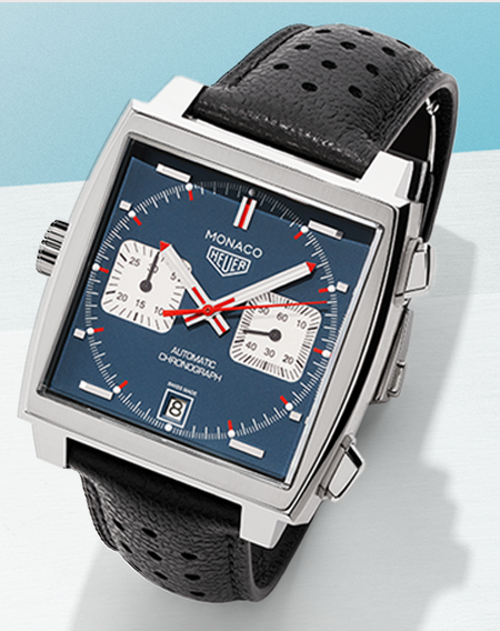 Tag Heuer monaco watch on a light blue background.