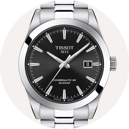 Tissot watch on beige background.